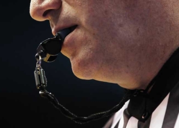 referee blowing whistle o